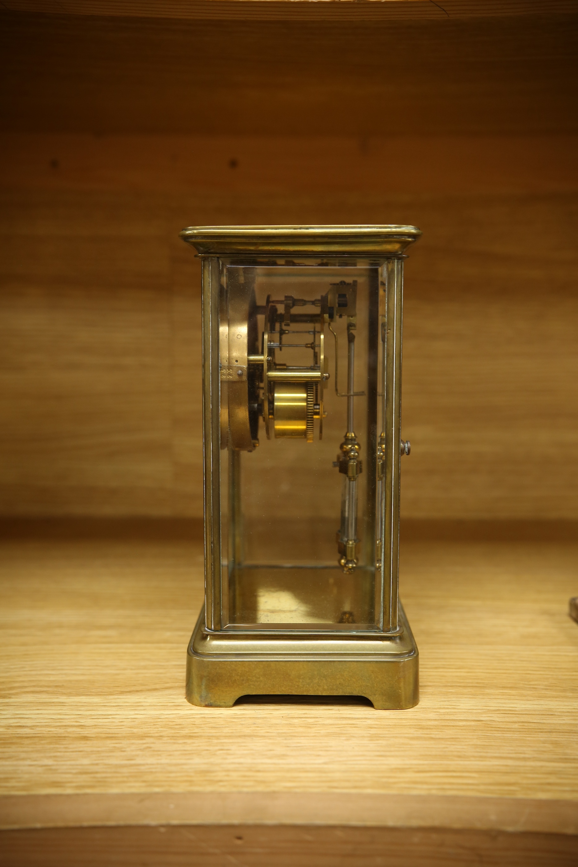 An early 20th century brass four glass mantel clock, 22cm. Condition - fair, not tested as working